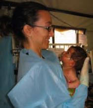 Dr. Cereste gives special attention to a sick infant.