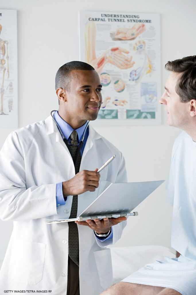 USA, California, Los Angeles, Male doctor talking to patient in hospital