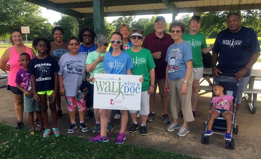 Dr. Green and walkers in Oak Park in West Paris, considered a lower socioeconomic area, (2017).