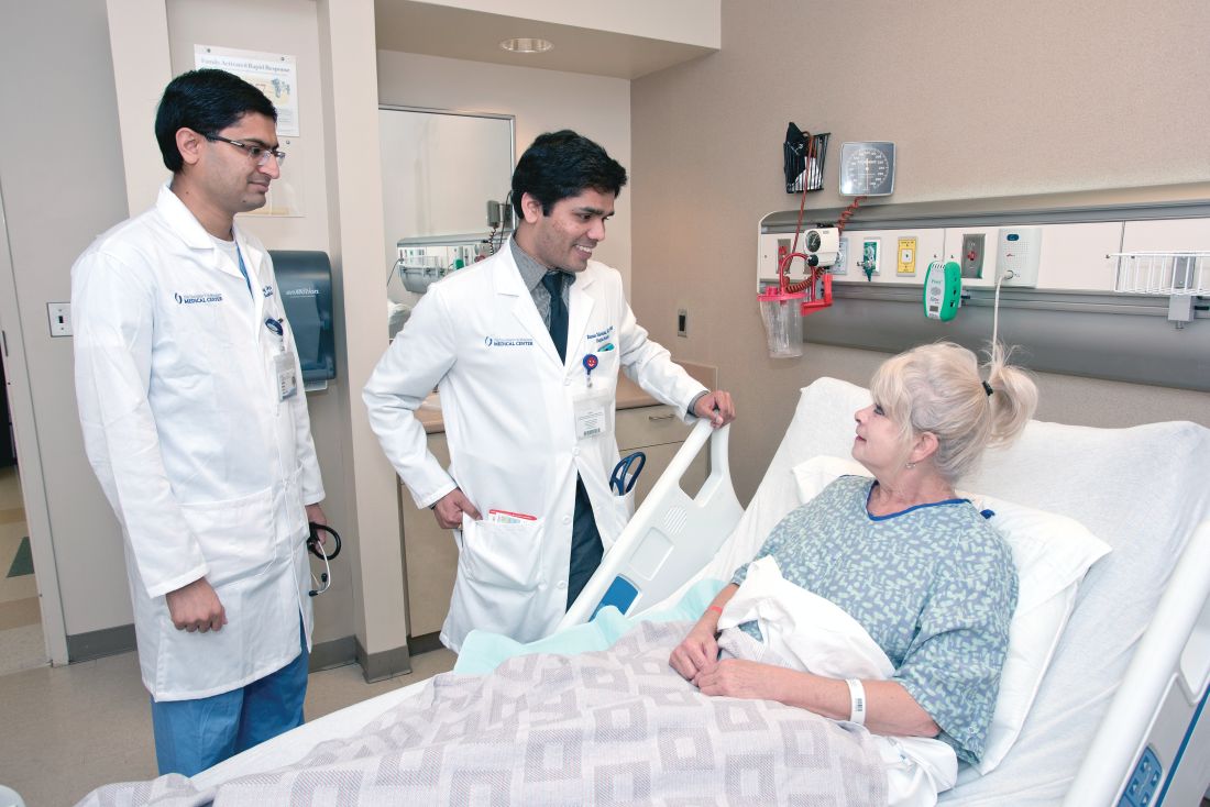Dr. Raman Palabindala, center, and Dr. Chirag Acharya, an internal medicine resident, speak with a patient.