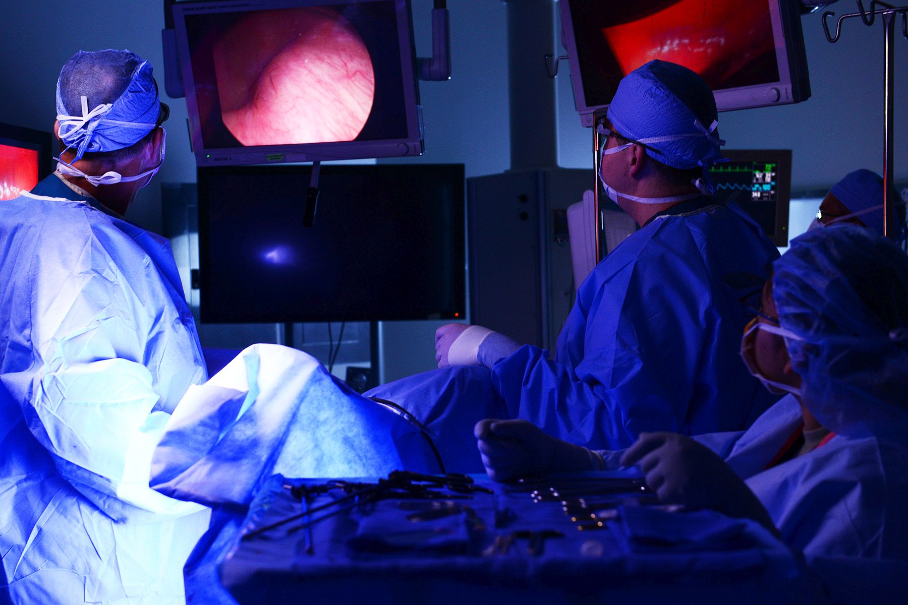 U.S. Air Force Maj. Arthur Greenwood and Capt. Stuart Winkler, 633rd Surgical Operations Squadron obstetricians, stitch up an incision after performing a laparoscopic hysterectomy at Langley Air Force Bae, Va., June 14, 2016.