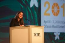 Dr. Nasim Asfar, the new president of SHM, speaking at Monday’s HM18 opening plenary.