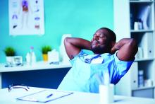 A doctor relaxes in his chair.