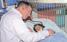 Dr. Fields examines a patient. The CHCC program often admits very sick children-many of whom are under- or uninsured.