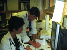 Robert Newborn, MD, director of the hospitalist program at Northern Westchester Hospital in Westchester County, N.Y., confers with Corina Sujic, MD, on a recent night shift.