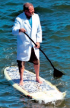 And paddle boarding in a white coat