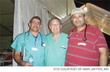 Dr. Reyes (left) and Dr. Jaffer (right), with Barth Green, MD, chair of neurological surgery at the Miller School of Medicine, after a long day at the tent hospital.