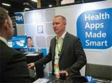 Attendees make their way throughout the tradeshow during the HM14 schedule at Mandalay Bay Resort and Casino in Las Vegas, Nev.