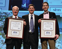 Outgoing SHM President Burke Kealey (center) awards SHM CEO Larry Wellikson (left) and Brad Flansbaum (right) with plaques for their MHM inductions at HM15 in National Harbor, Md.