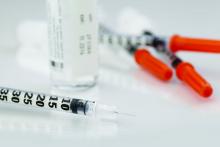 Insulin syringes are shown.